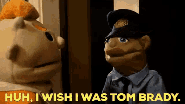 a police officer is talking to a puppet that says huh i wish i was tom brady .