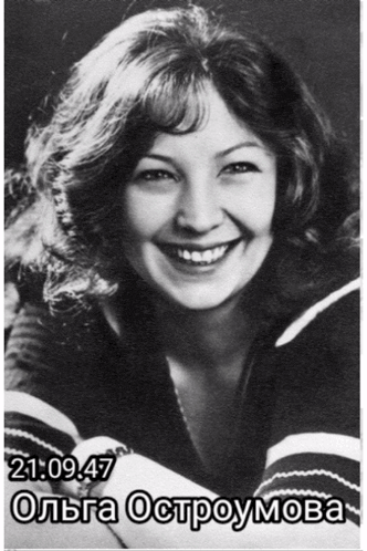 a woman is smiling in a black and white photo with the time 21:49:47