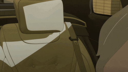 the back seat of a car has a headrest and a belt