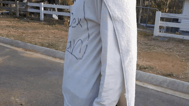 a person wearing a grey shirt that says dex