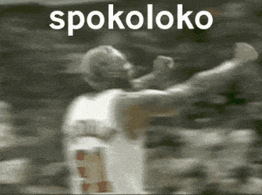 a blurred image of a basketball player with the word spokoloko written above him