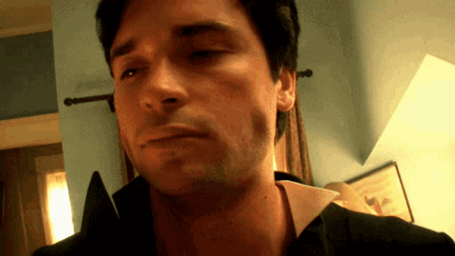a close up of a man 's face and neck