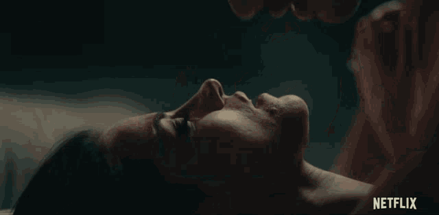 a close up of a man and woman kissing with netflix written in the bottom right corner