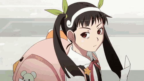 a girl with pigtails is wearing a pink backpack with a teddy bear on it .