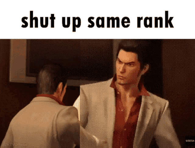 a man in a suit and red shirt is talking to another man in a suit and red shirt ..