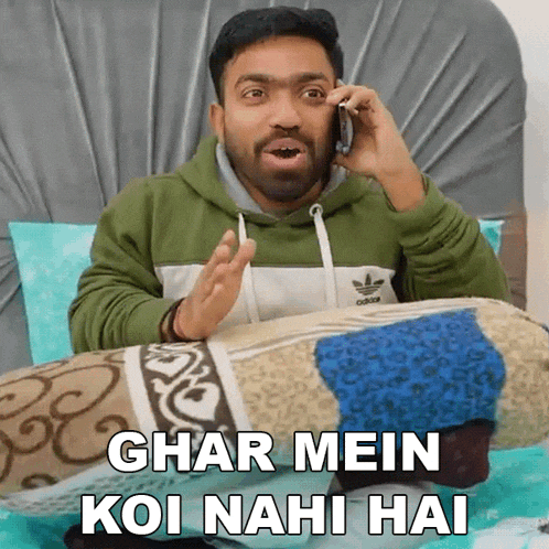 a man talking on a cell phone with the words ghar mein koi nahi hai above him