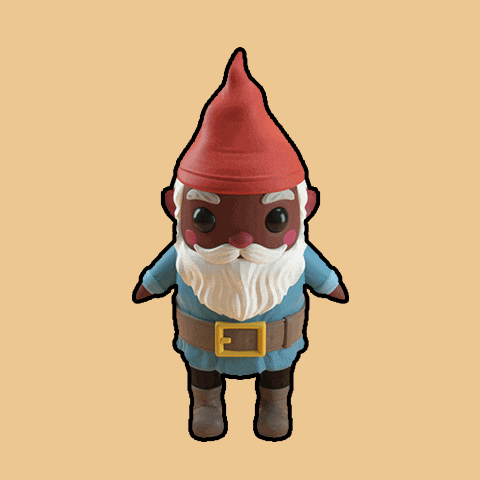 a figurine of a gnome with a red hat and white beard