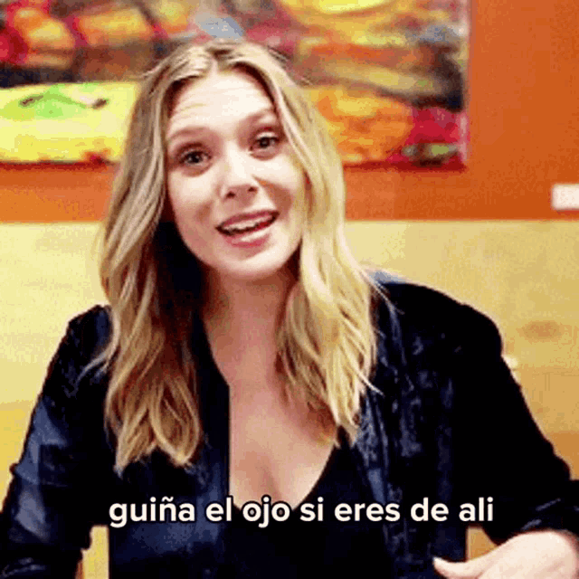 a woman in a black shirt says guiana el ojo si eres de ali .