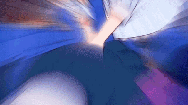 a blurry picture of a person 's feet and a blue background