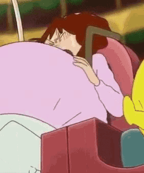 a cartoon character is riding a roller coaster with a yellow duck .