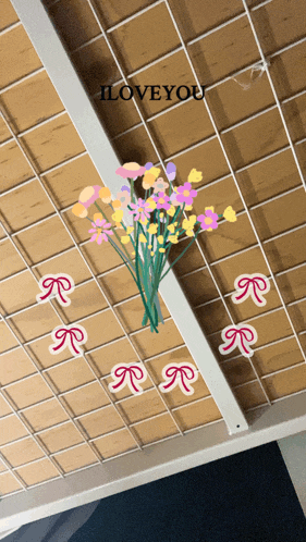 a bunch of flowers are hanging from the ceiling with the words i love you above them