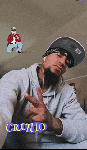 a man wearing a bandana and a hat has the name cruzito on his chest