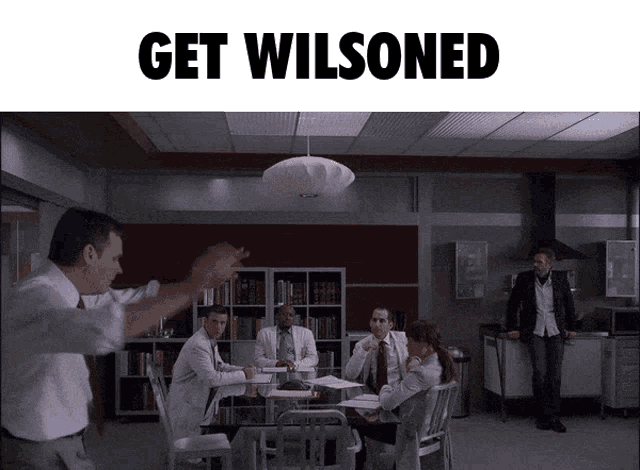 a group of people sitting around a table with the words get wilsoned on the bottom