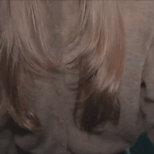 a close up of a woman with long hair