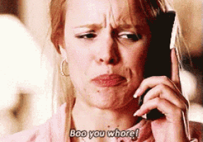 a woman is talking on a cell phone and says boo you whore !