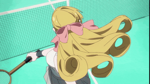 a girl with blonde hair is holding a tennis racquet on a tennis court