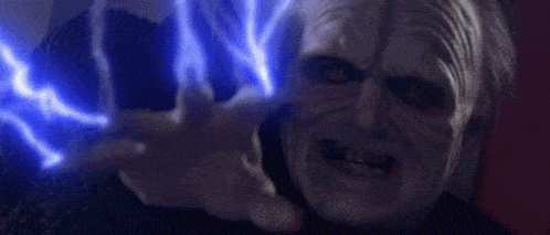 a close up of a person 's face with a blue light coming out of it .