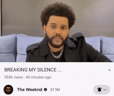 a man with a beard is sitting on a couch with the words breaking my silence below him
