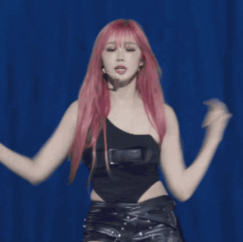 a woman with red hair is dancing next to another woman with blonde hair
