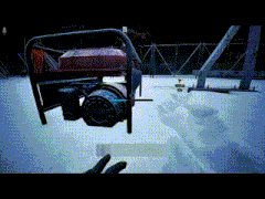 a person 's hand is pointing at a red item in the snow