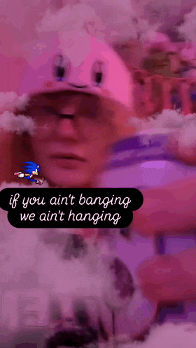 a man in a pink hat says if you ain t banging we ain t hanging on a pink background