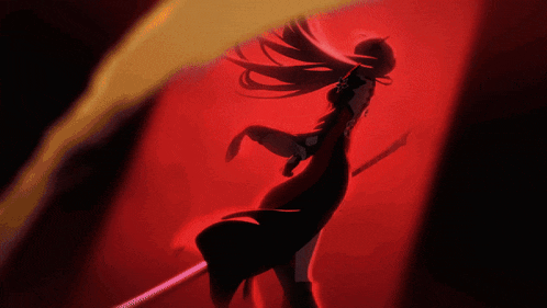 a silhouette of a woman in a red dress