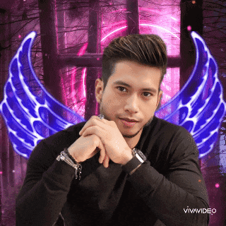a man in a black shirt with blue wings behind him and the words vivavideo on the bottom