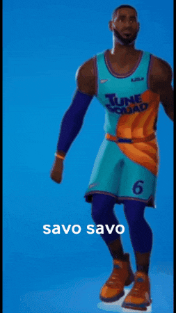 a man in a tune squad jersey is dancing on ice .