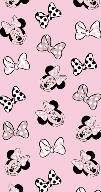 a pink background with minnie mouse faces and bows on it