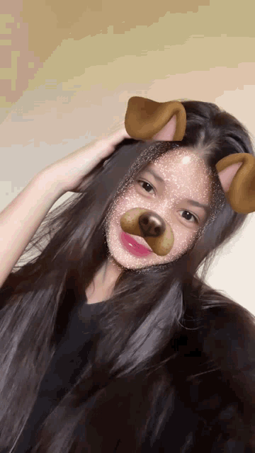 a girl with long hair wearing a dog mask