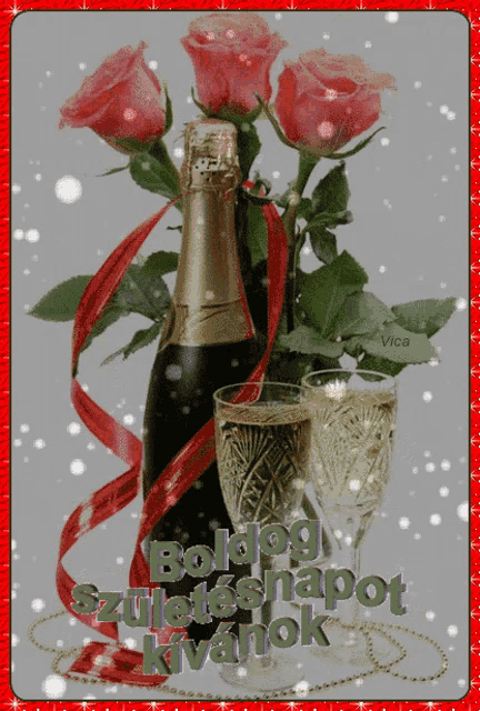 a bottle of champagne sits next to a bouquet of roses and two glasses of champagne