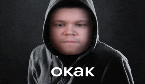a man in a hooded sweatshirt with the word okak written on the bottom