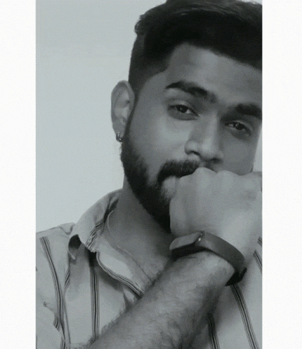 a black and white photo of a man with a beard
