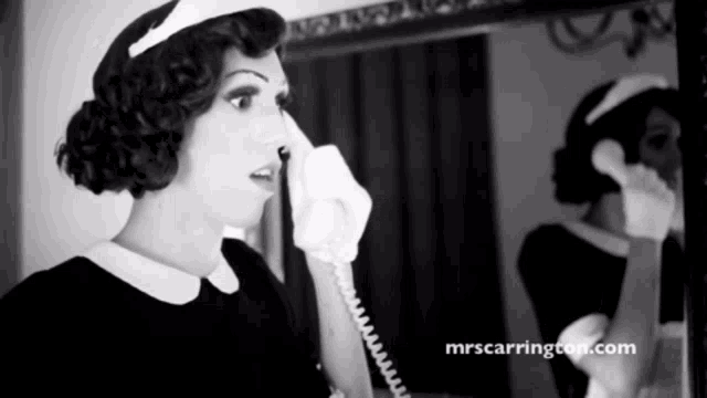 a black and white photo of a woman talking on a telephone with the website mrscarrington.com