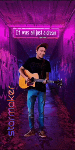 a poster of a man holding a guitar with the words it was all just a dream