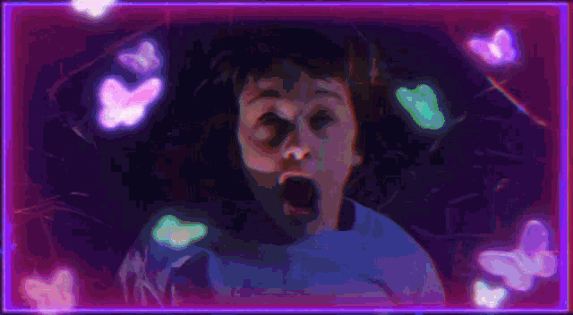 a person with their mouth open is surrounded by glowing butterflies in a purple frame .