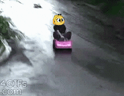 a 4gifs.com screenshot of a person riding a go kart on a road