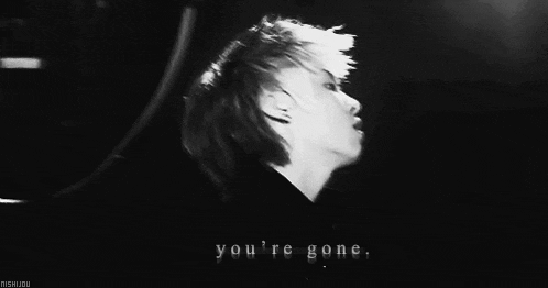 a black and white photo of a person 's face with the words `` you 're gone '' written above it .
