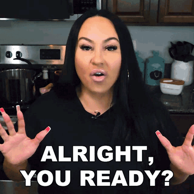 a woman says alright you ready in front of a stove