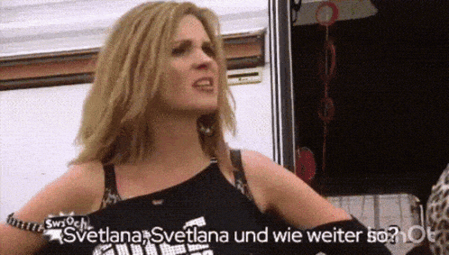 a woman in a black tank top says svetlana svetlana and wie weiter so ?