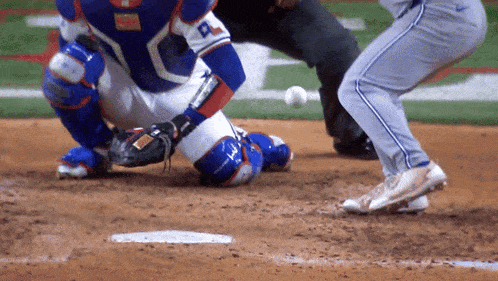 a baseball player wearing a blue and orange jersey with the letter p on it