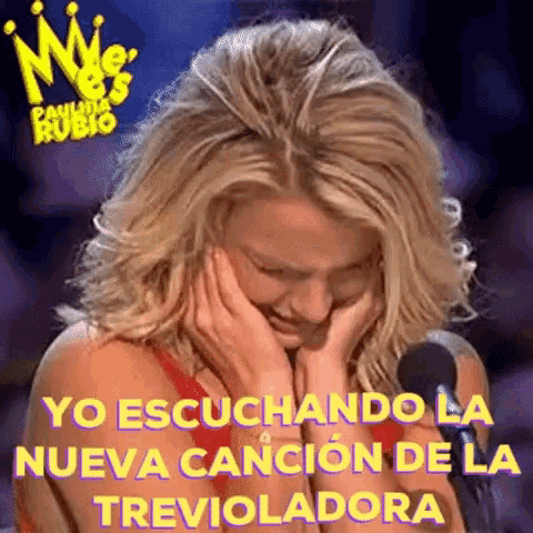 a woman is crying while listening to a song in spanish