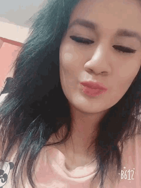 a close up of a woman 's face with a b612 watermark