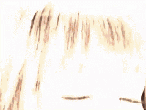 a close up of a woman 's face with her eyes closed and her hair .