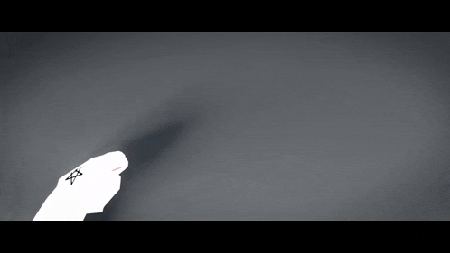 a person 's hand is reaching for a keyboard on a gray surface