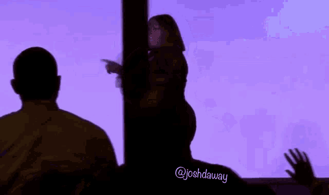 a silhouette of a man and a woman with the name joshdaway on the bottom right