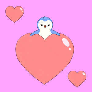 a penguin is sitting inside of a large heart