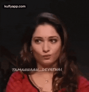 a close up of a woman making a funny face