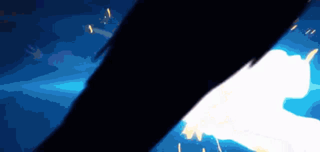 a person is standing in a dark room with a light coming out of the bottom .