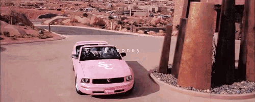 a pink mustang with the word money on the front
